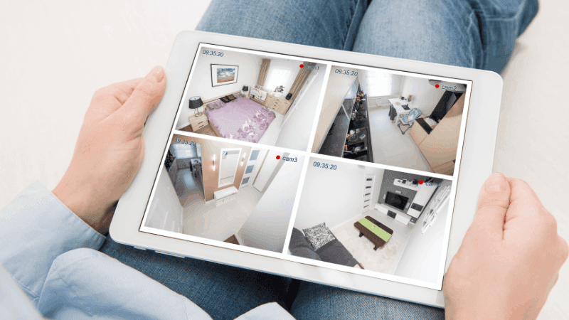 Tablet with 4 videos showing security camera footage