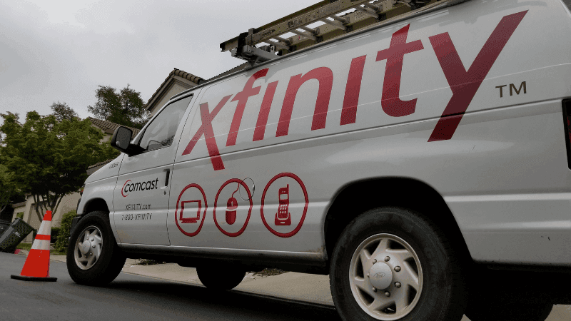 Xfinity truck parked outside.