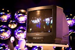 Old sony tv with lights in the background