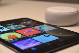 Close up on smartphone with echo dot