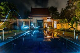 swimming pool with lightning striking