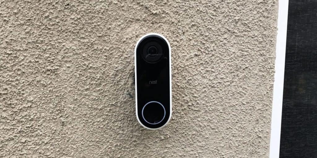 nest hello doorbell mounted to stucco wall.