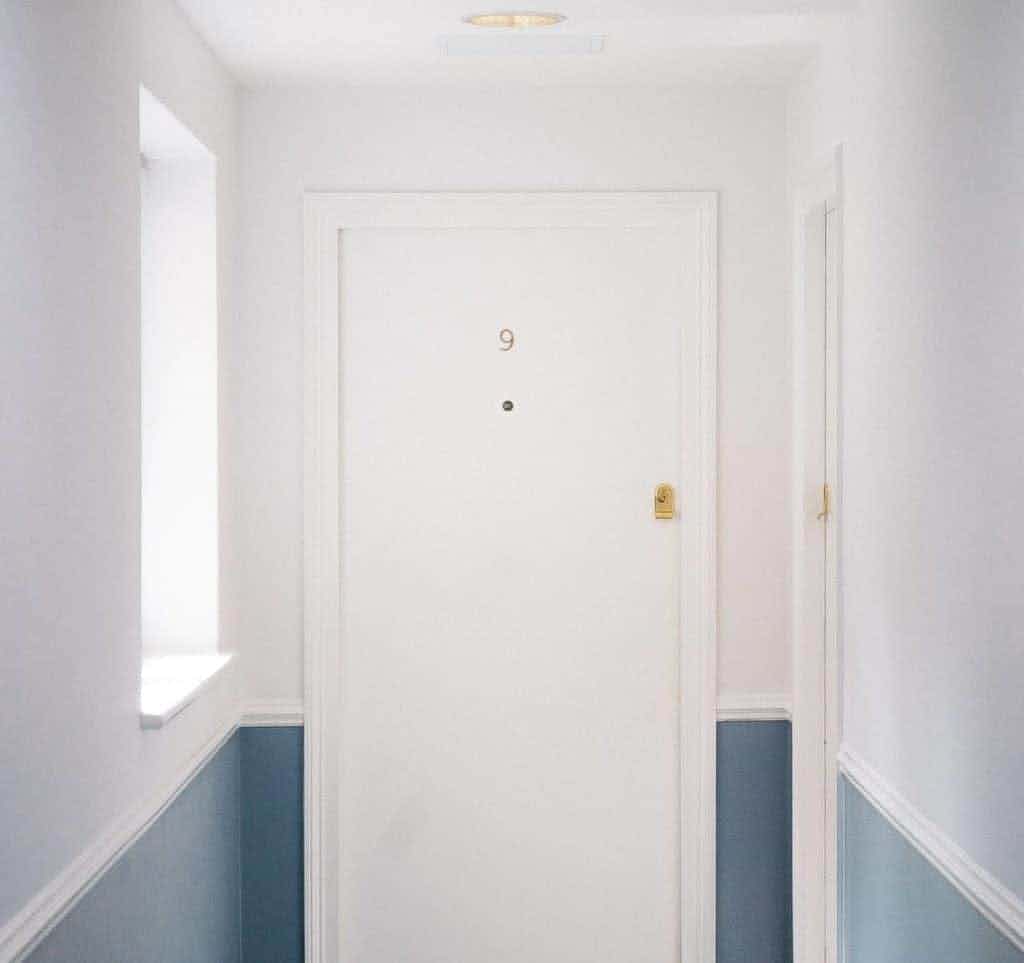 A white door from an apartment building.