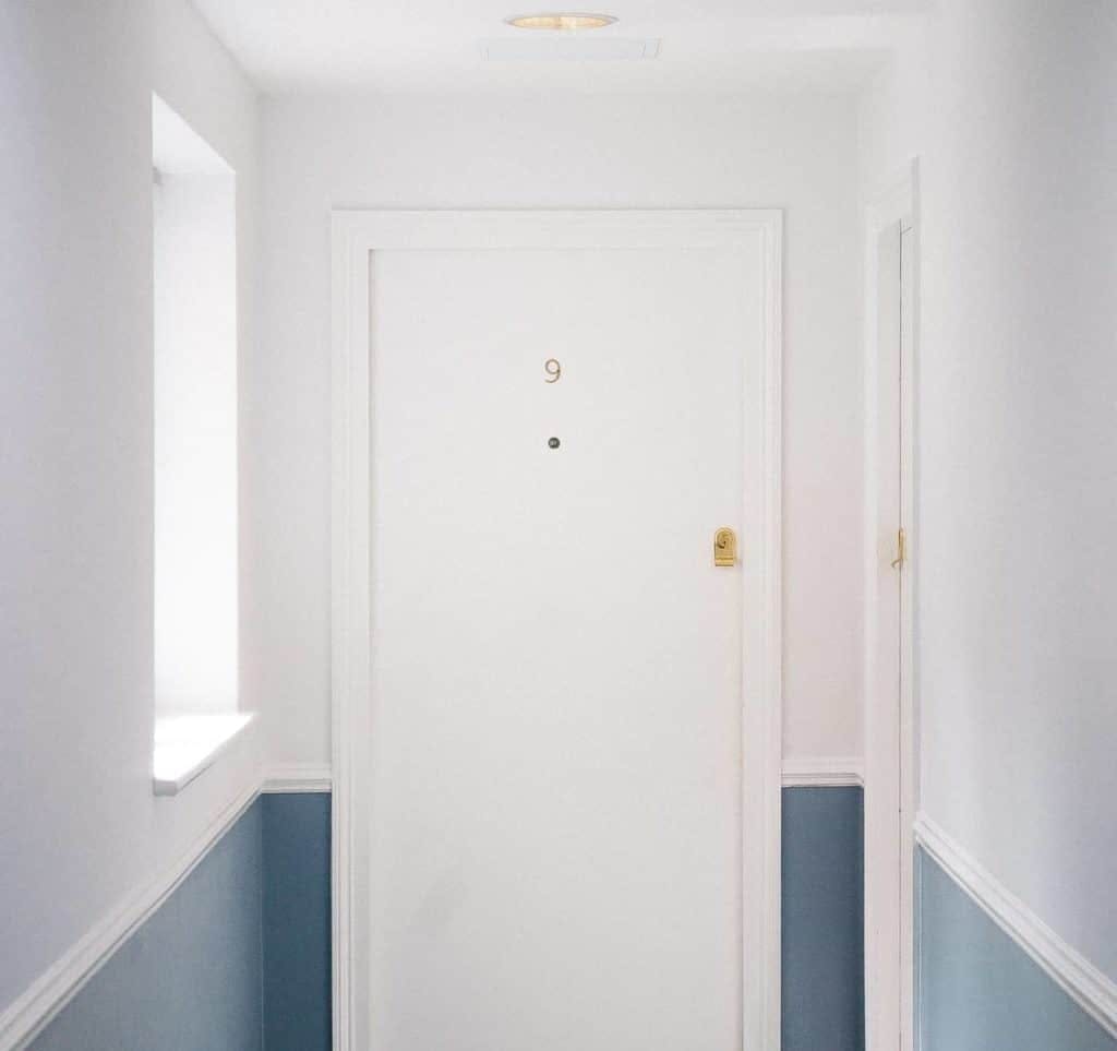 A white door from an apartment building.