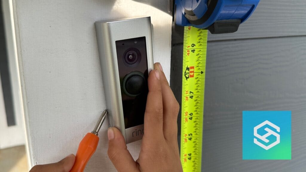 Ring Doorbell next to tape measure at 4 ft.