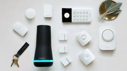 Simplisafe security system with all accessories laid out on table.