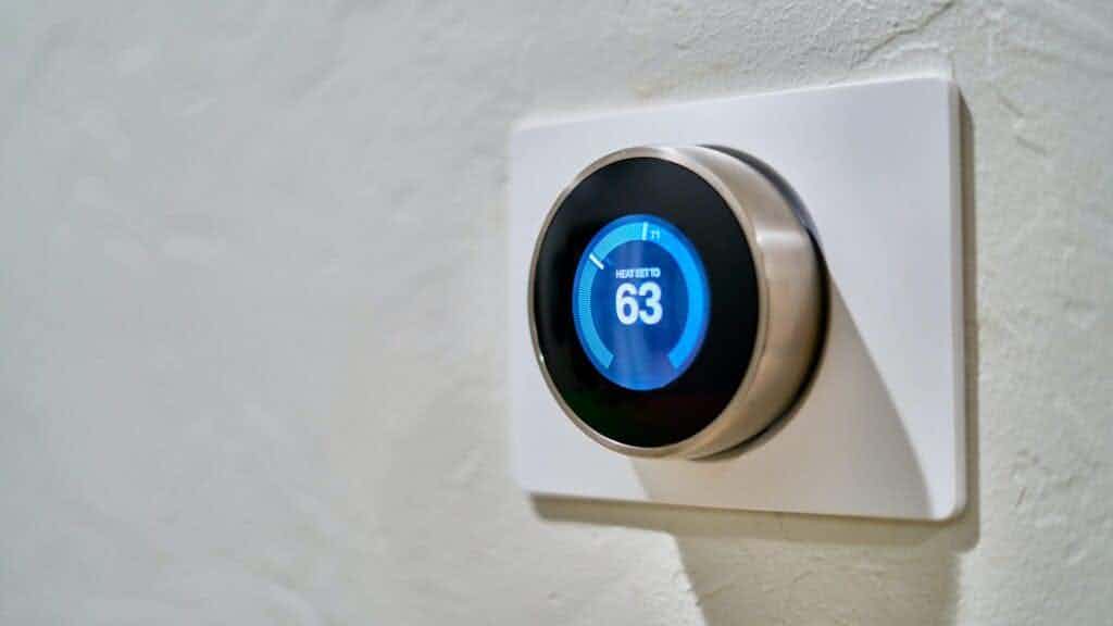 Nest smart thermostat on wall