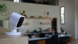 Blink mini camera with kitchen behind it