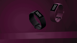 2 Fitbits, Black and purple with a purple background.