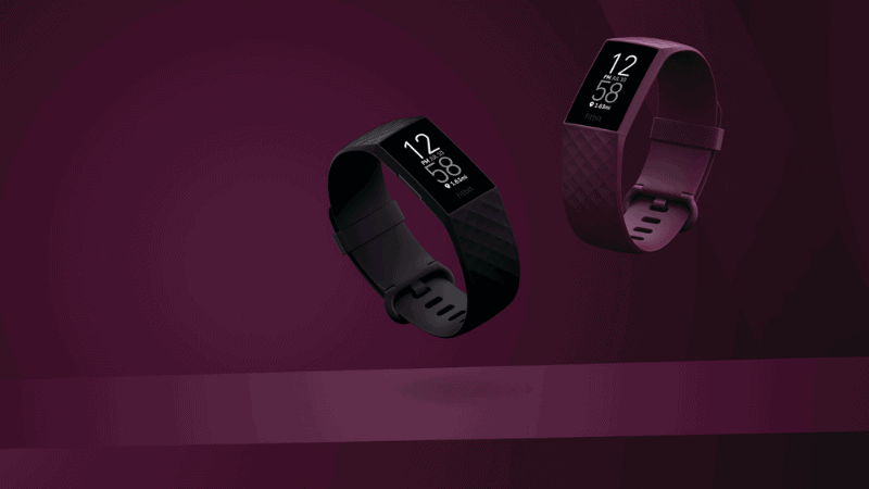 2 Fitbits, Black and purple with a purple background.