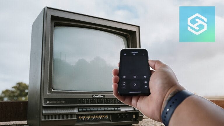 Smart phone in front of old TV