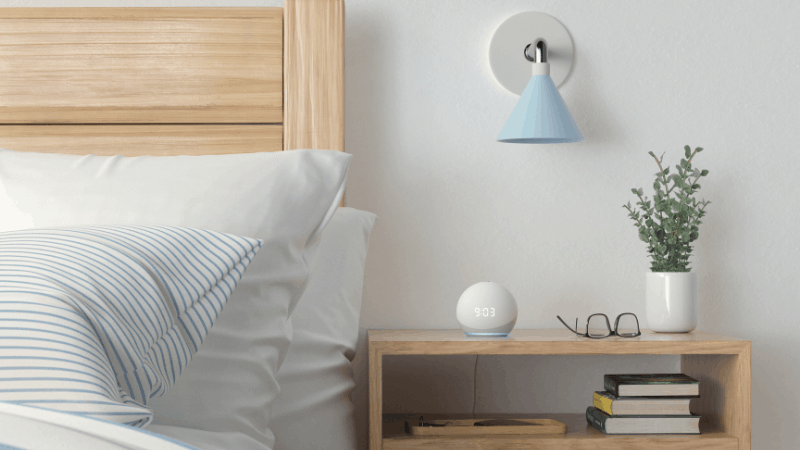 echo dot voice assistant on night stand in bedroom