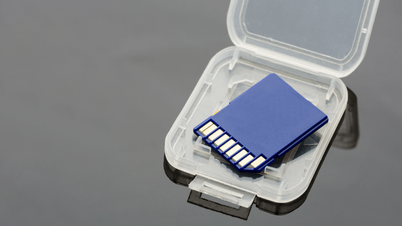 Blue SD card in a plastic case.