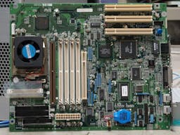 A computer motherboard showing the processer, RAM, and other components.