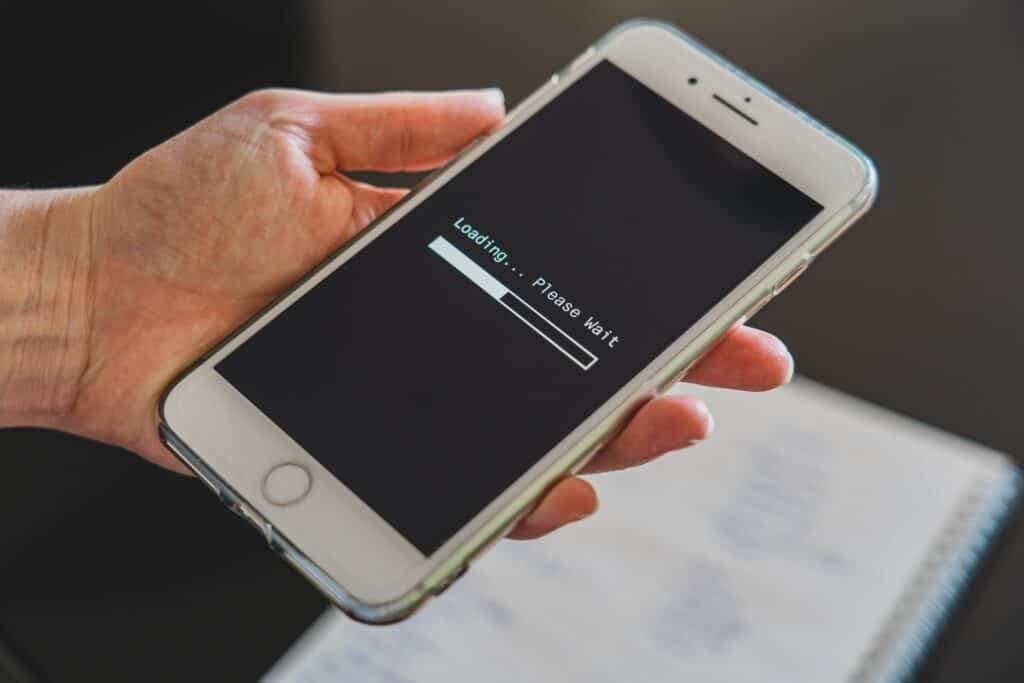 Smartphone that displays "Loading please wait" on screen.