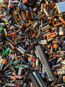 a variety of batteries in a pile