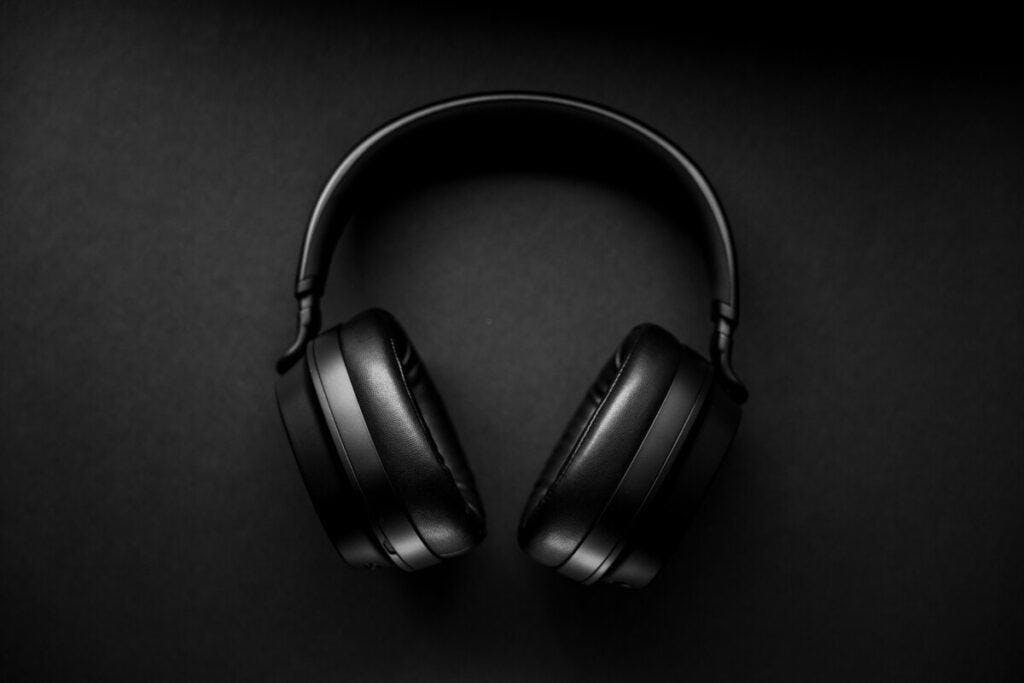 black headphones on black background