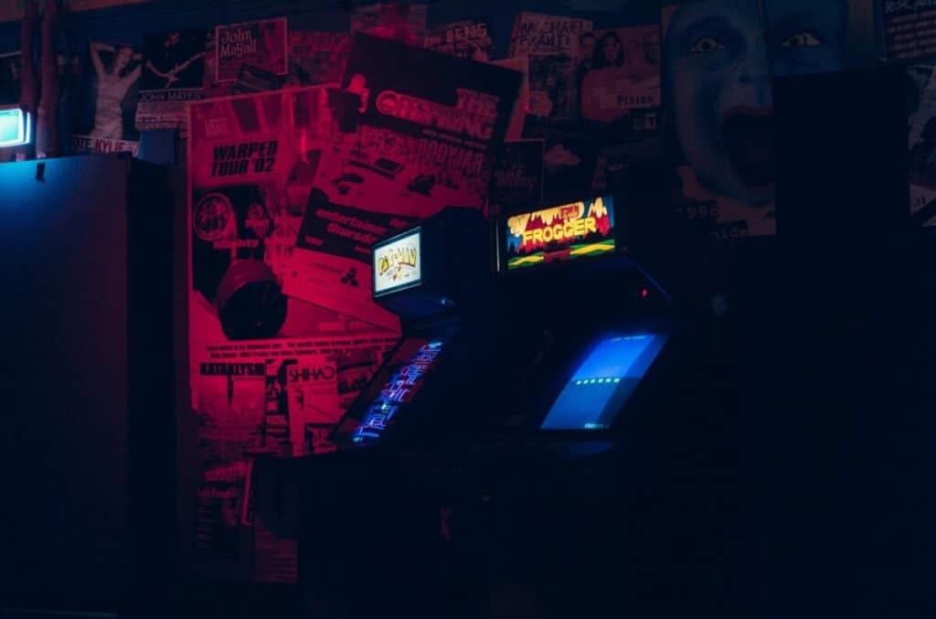 a dark room with arcade games