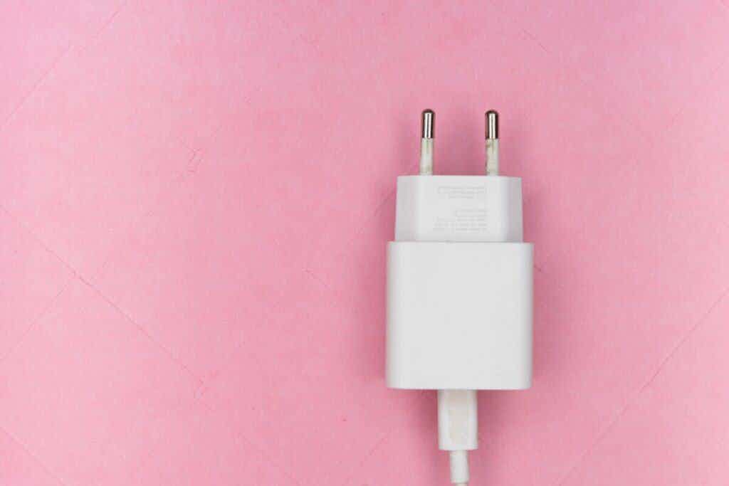 white power cord on pink background