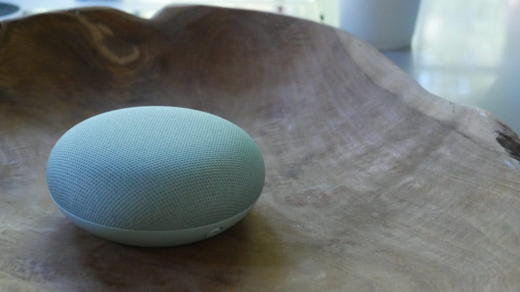 google home mini in some kind of bowl