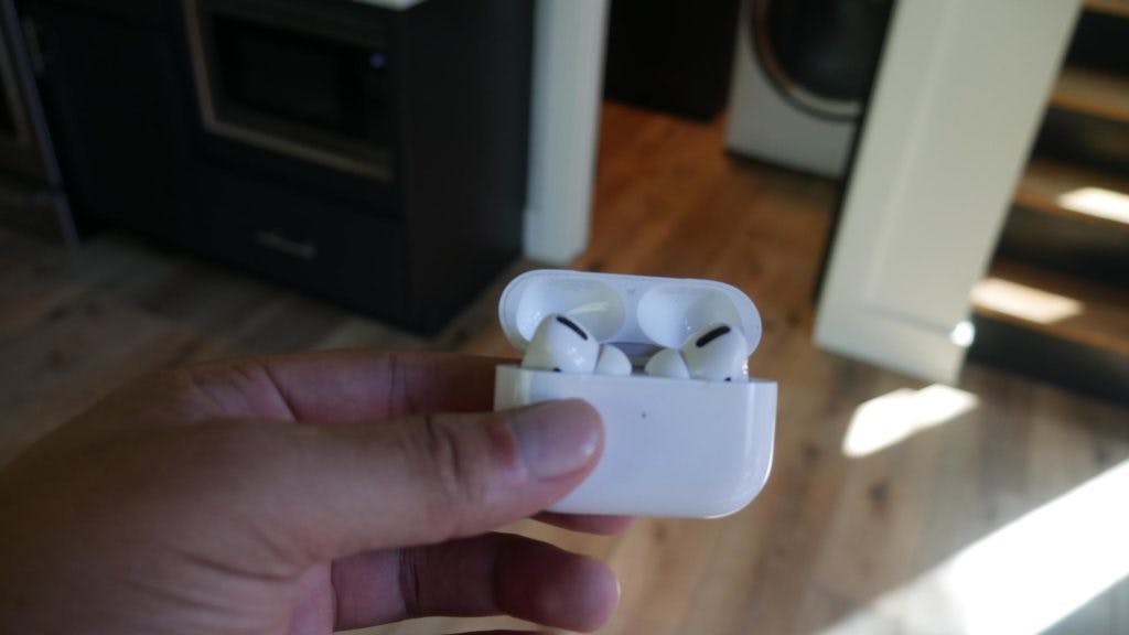 Airpods in hand