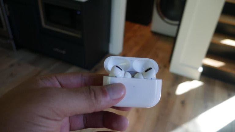 Airpods in hand