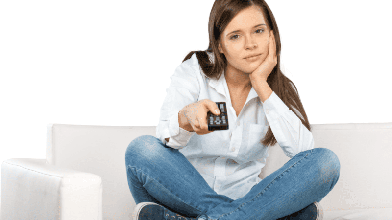 woman watching tv lady with remote