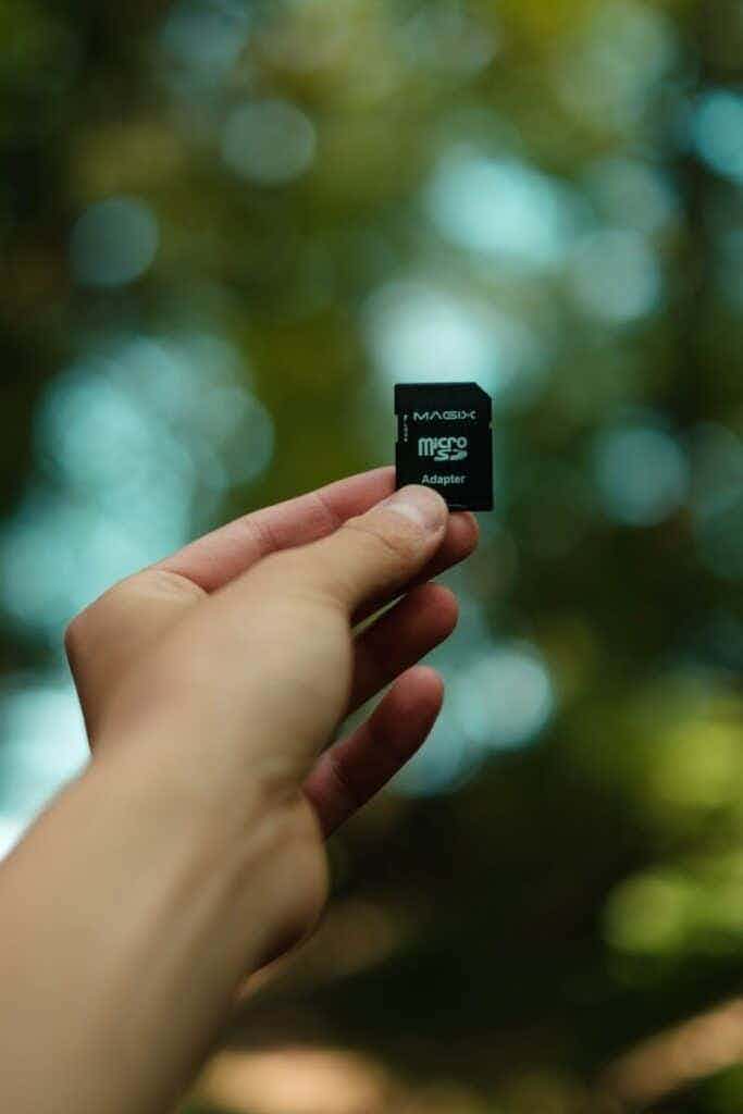 Hand holding a micro SD card