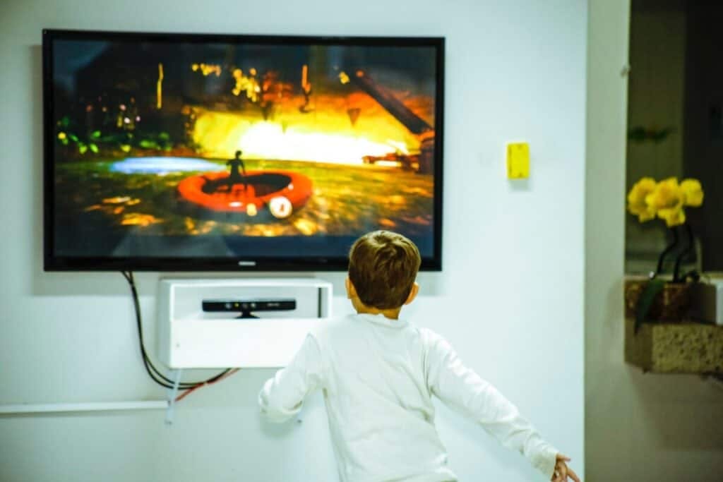 child in front of samsung tv