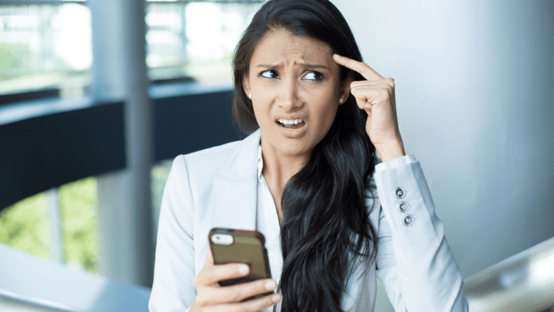 woman thinking on phone