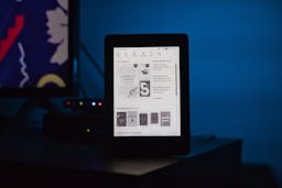 Kindle next to a screen