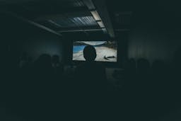 person standing in front of projector