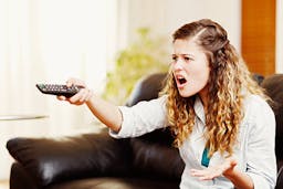 woman upset watching tv