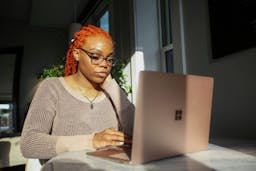 Woman sitting at laptop