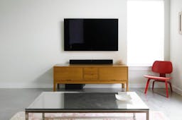 TV on wall with soundbar