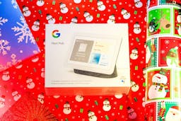 Google Nest Hub in a box over Christmas paper