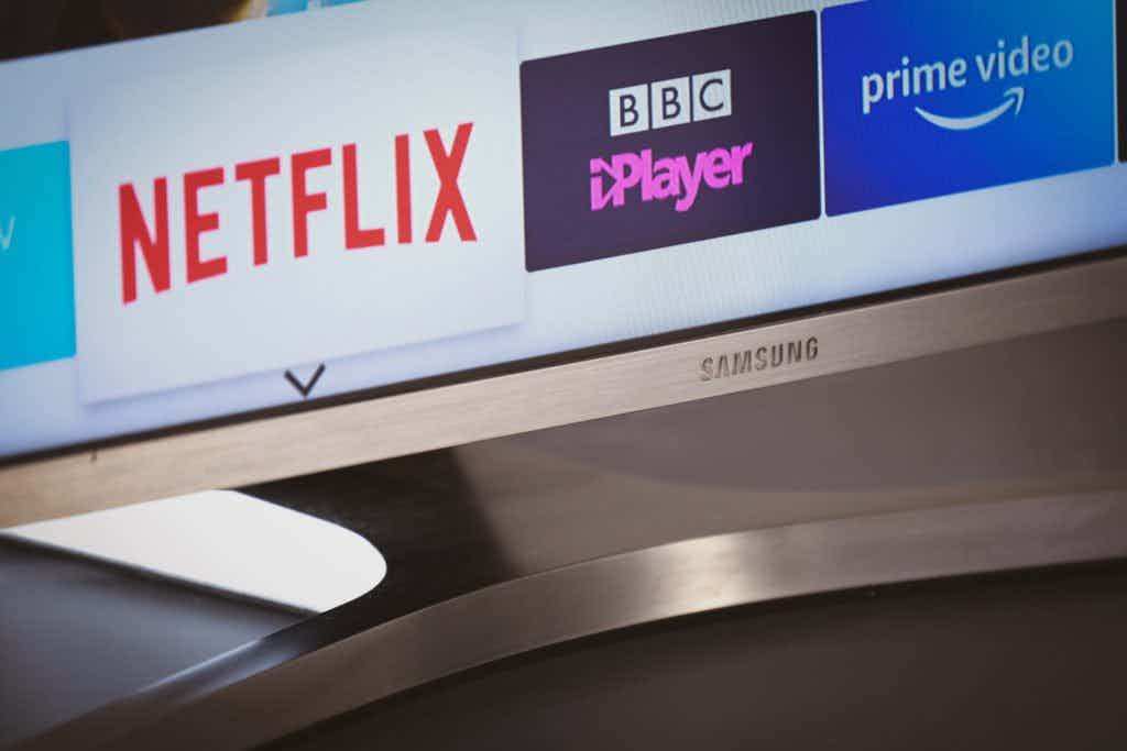 Closeup of a samsung TV with Netflix, BBC, and Prime Video apps showing