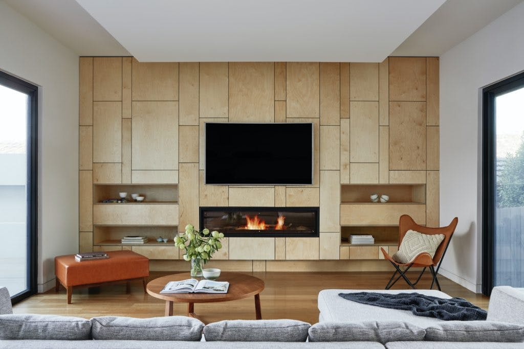 TV above a built in fireplace