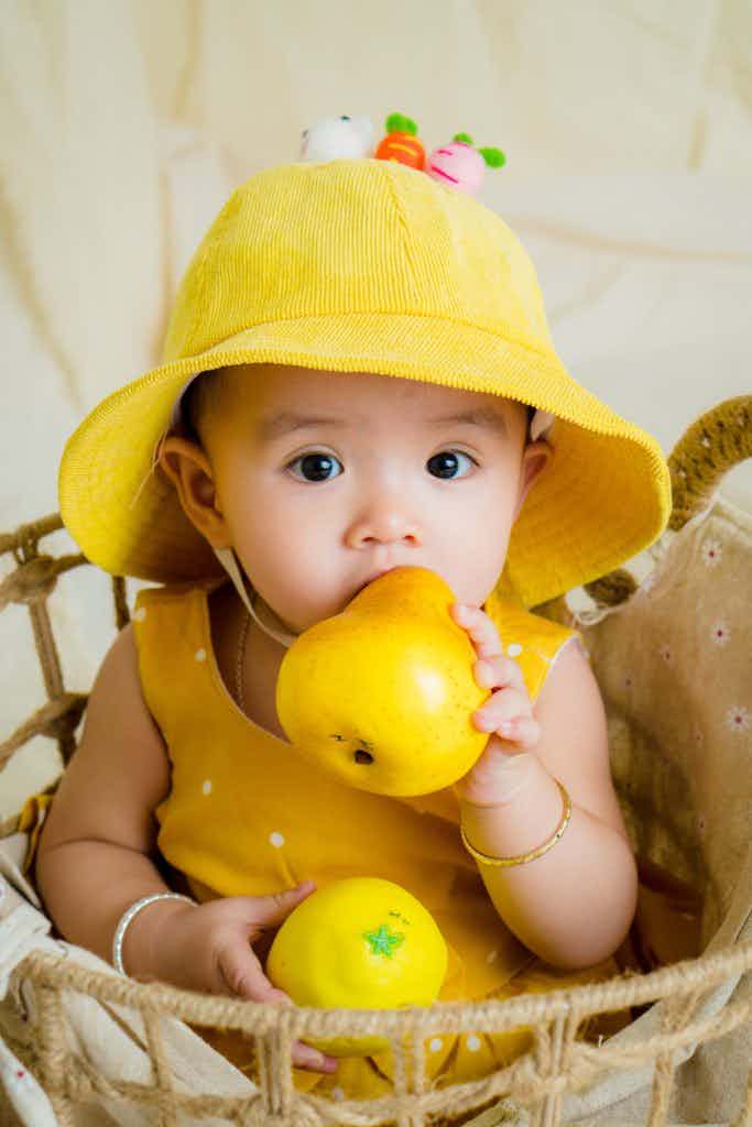 baby wearing yellow