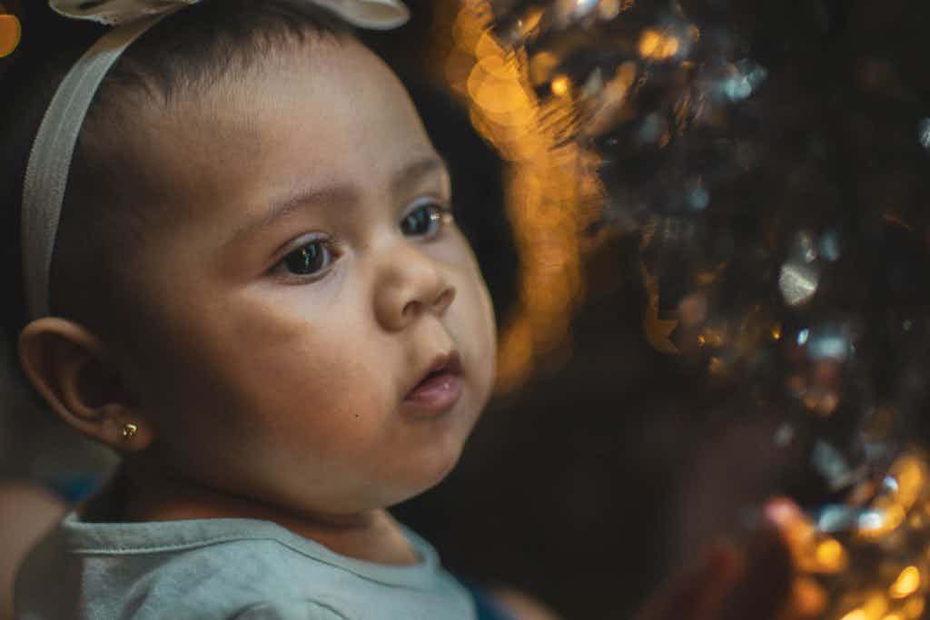 Baby with lights in the background