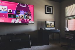 Smart TV and a computer in a living room.