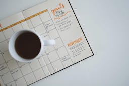 Calendar with coffee cup on it
