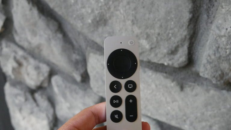 apple tv remote with rocks in background